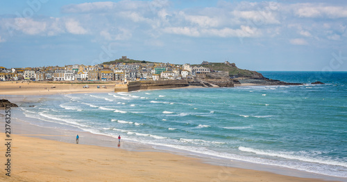Harbour at St Ives with waves crashing against the harbour wall taken in St Ives, Cornwall, UK on 28 February 2016