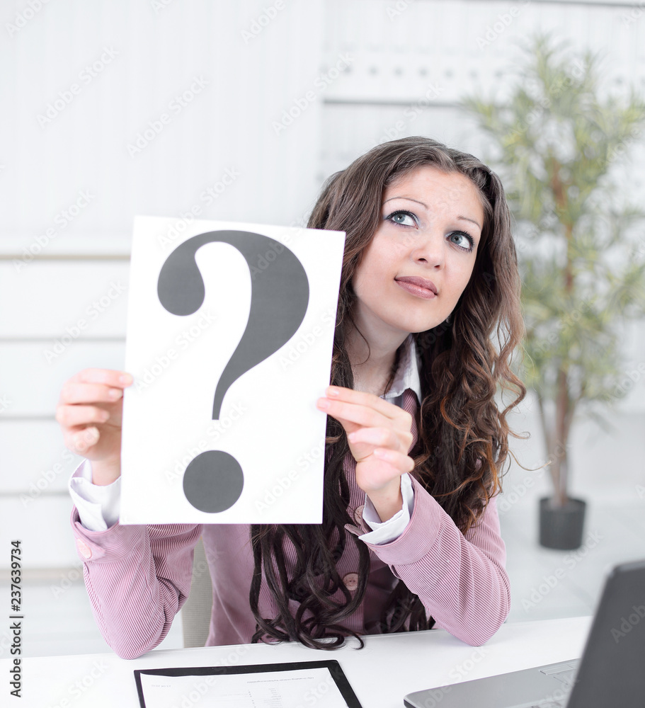 thoughtful business woman showing a question mark thoughtful business woman showing a question mark