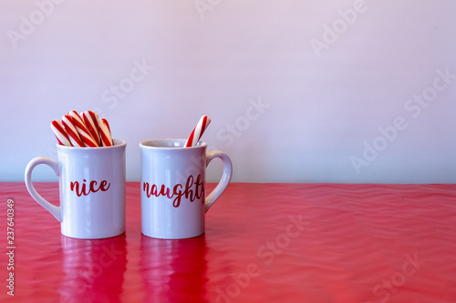 naughty or nice mugs with candy canes