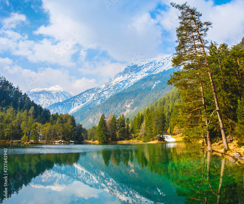 Fototapeta Naklejka Na Ścianę i Meble -  Fantastic views of the tranquil lake with amazing reflection. Mountains & glacier in the background. Peaceful & picturesque landscape. Location: Austria, Europe. Artistic picture. Beauty world