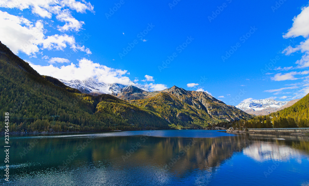 Lake of Ceresole Reale, near the Nivolet pass, clear autumn morning, blue sky, Piedmont, Italy