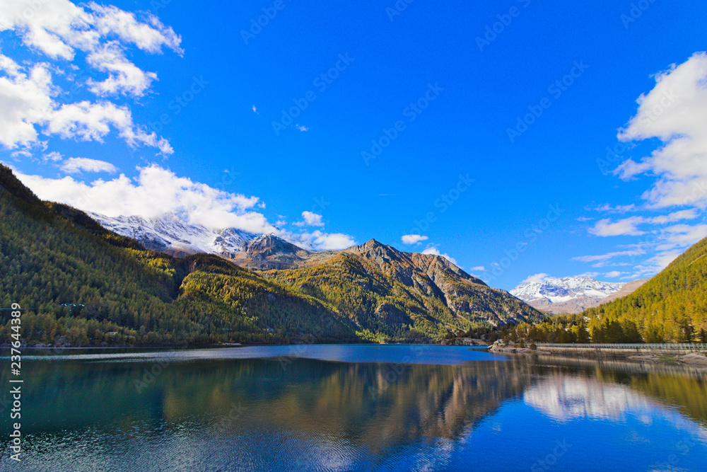 Lake of Ceresole Reale, near the Nivolet pass, clear autumn morning, blue sky, Piedmont, Italy
