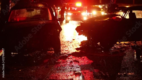 Car accident. Police flashers illuminate the broken cars.