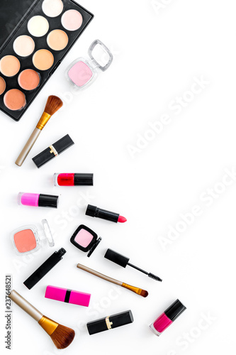 Professional cosmetics set with palette of eyeshadows on white background top view copyspace