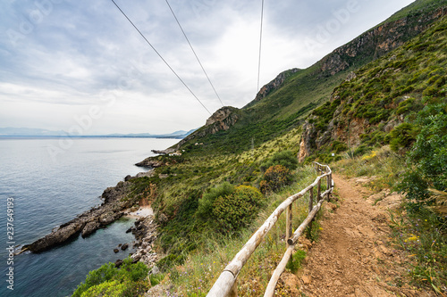 Hiking trail on the coastline of Gulf of Castellamare at Zingaro Nature Reserve, San Vito Lo Capo, Sicily, Italy photo