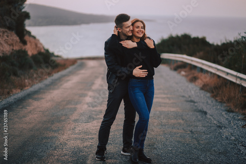 Young couple in love on a mountain road