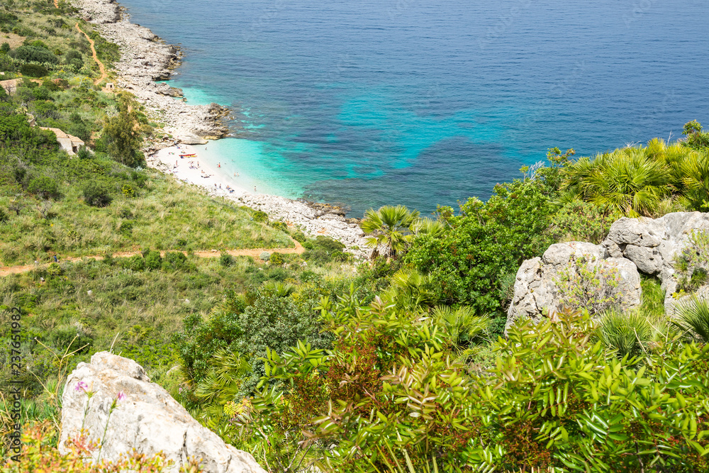 Cove “Cala dell’Uzzo” at Zingaro Nature Reserve, a small lovely beach with azure water, San Vito Lo Capo, Sicily, Italy