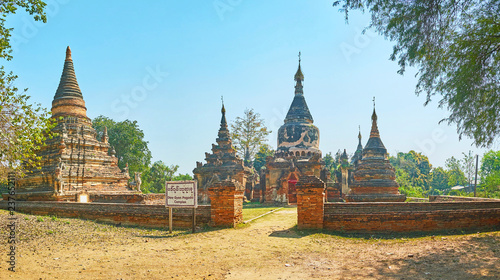 Panorama of the archaeological site of Daw Gyan pagoda built of red brick and decorated with carved geometric patterns and sculptures of Nats and mythical creatures, Ava (Inwa), Myanmar. photo