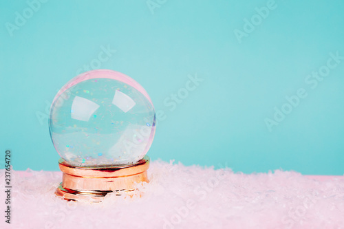 Beautiful snow ball on pink over blue pastel background. photo