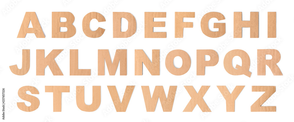 Latin brown cardboard alphabet on white background