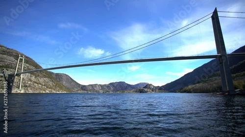 POV aerial view of Lysefjord vehicle Suspension Bridge Road13 over Fjord a Landscape of scenic mountain beauty Norway Scandinavia Europe photo