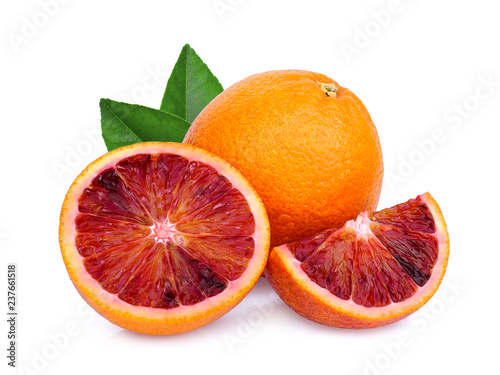 whole and slices blood orange with green leaf isolated on white background