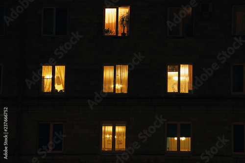 lighted night windows of houses