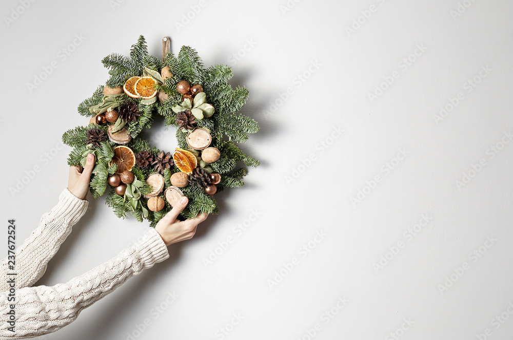 Rustic Christmas wreath on a gray background