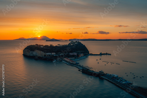 A view of the Islet Of Nisida at sunset, from Parco Virgiliano, in Posillipo, Naples, Italy photo