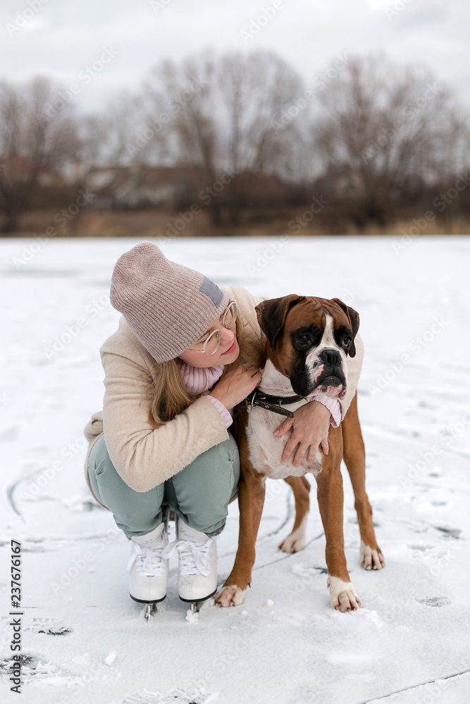 woman and his dog in winter park