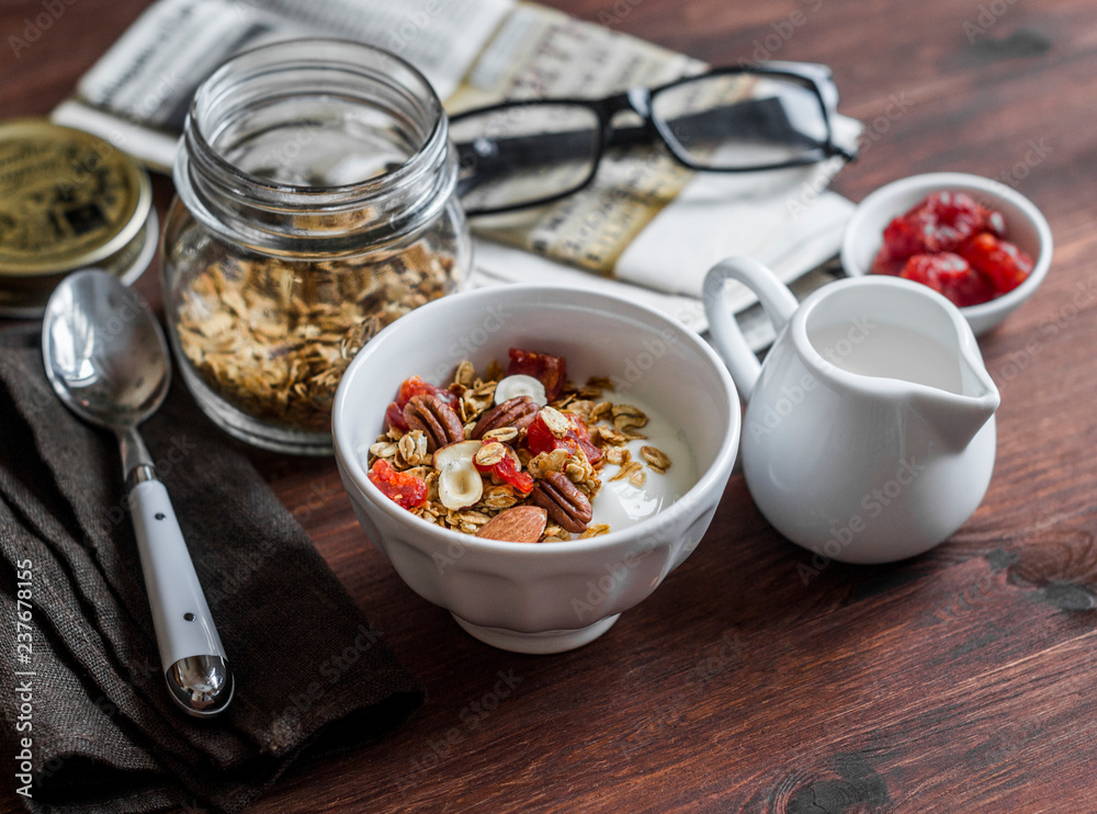 Morning breakfast table - greek yogurt with homemade granola on a dark background. Flat lay Morning breakfast table - greek yogurt with homemade granola on a dark background. Flat lay