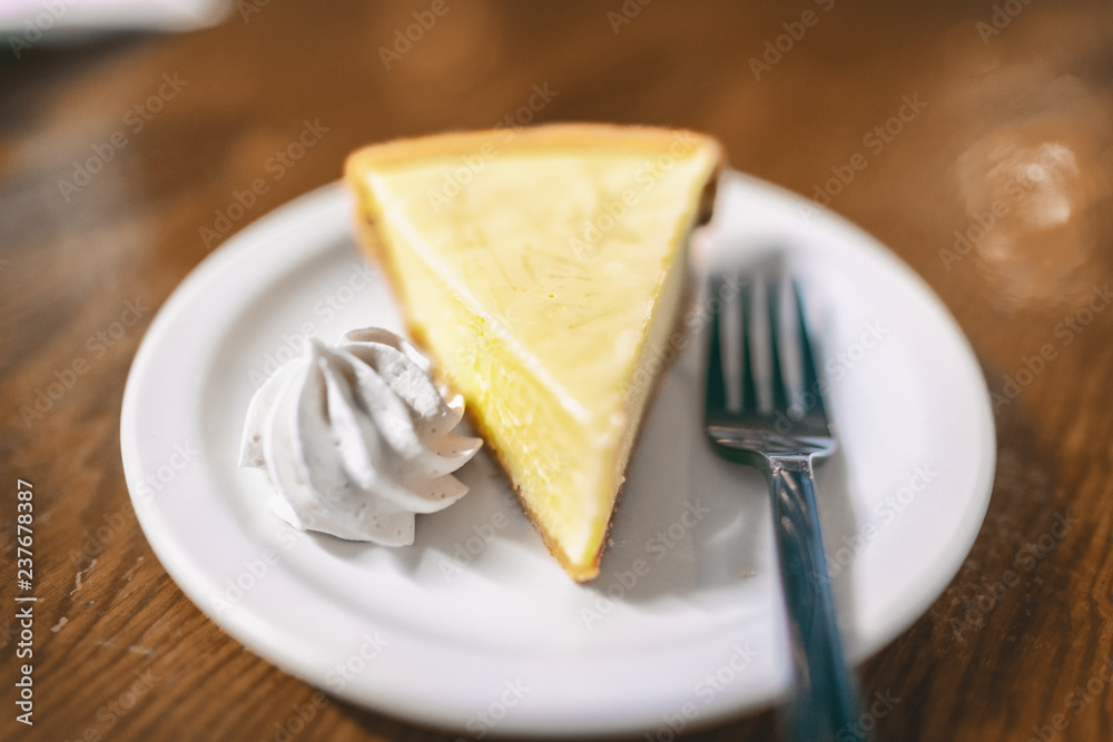 Key lime pie slice at Florida restaurant in the Keys. World famous american traditional dessert homemade, with whipped cream topping on the side. Local food, USA travel. Key lime pie slice at Florida restaurant in the Keys. World famous american traditional dessert homemade, with whipped cream topping on the side. Local food, USA travel.
