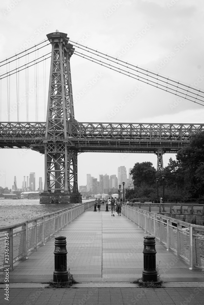 The East River Promenade and Williamsburg Bridge, in Manhattan, New York City