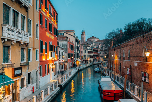A canal at night, in Venice, Italy © jonbilous