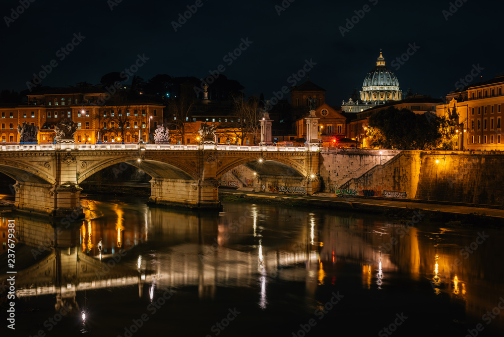 Ponte Vittorio Emanuele II and St. Peter's Basilica at night, in Rome, Italy