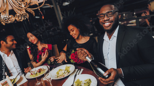 Photography Group of Happy Friends Meeting and Having Dinner