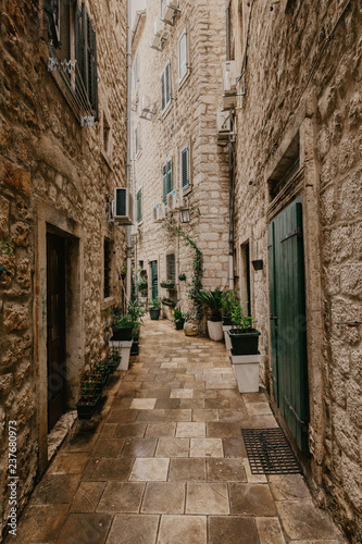 small street in an old European city with narrow aisles © Fototocam
