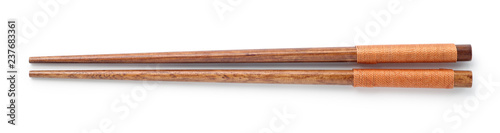 Top view of wooden chopsticks on white background photo