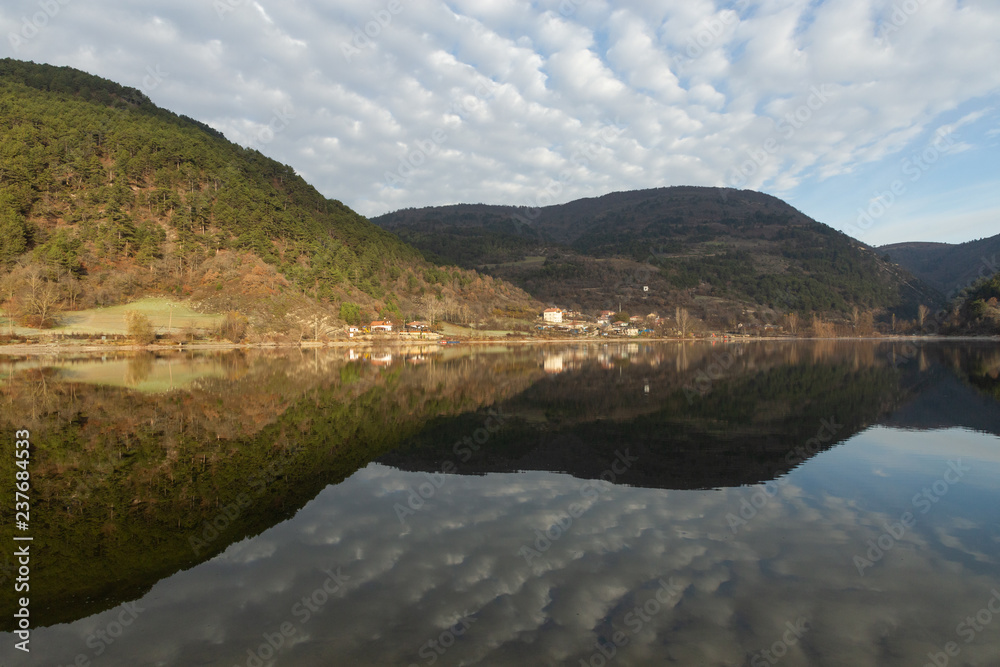 the village of Çubuklu reflected the calm waters of Çubuklu Lake in the Bolu mountains of Turkey