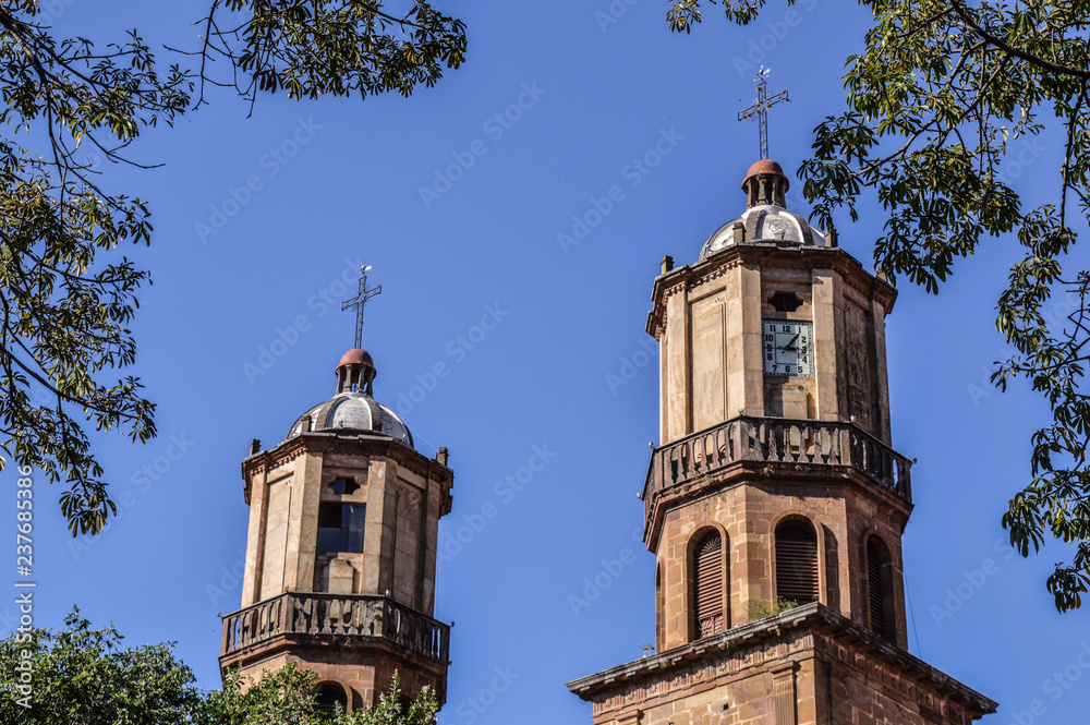 two towers with blue sky background