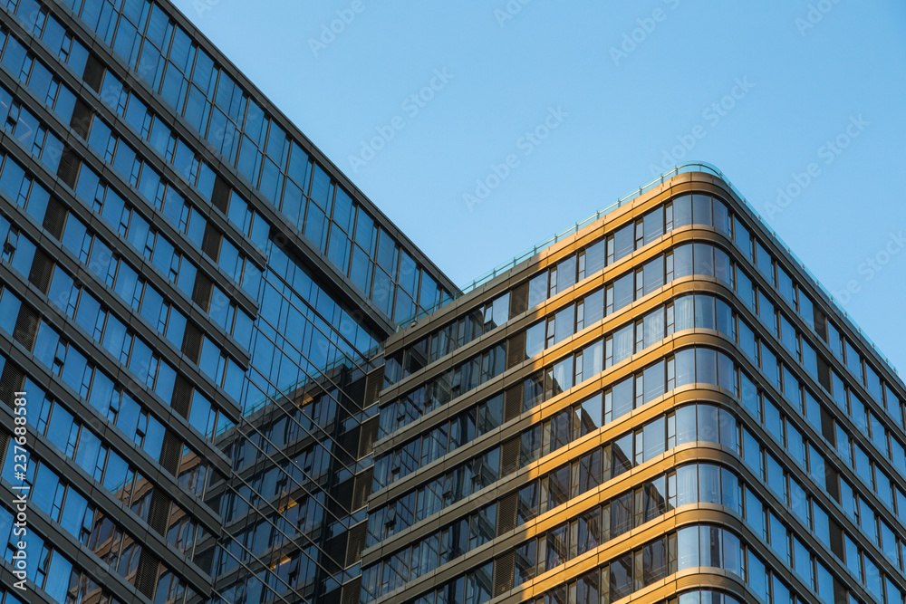 Fototapeta premium Modern office building against blue sky.
