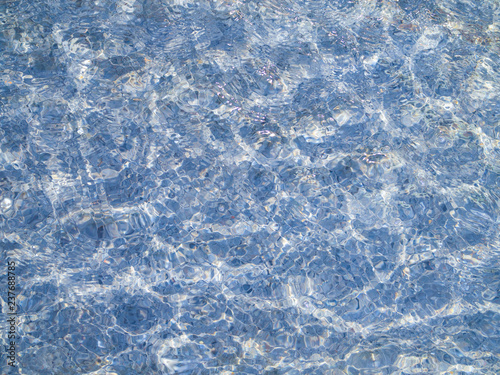 Beautiful pattern of blue water reflecting the sunlight