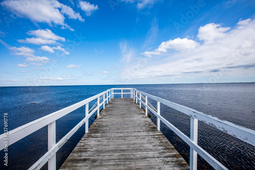 wooden pier on the blue sea