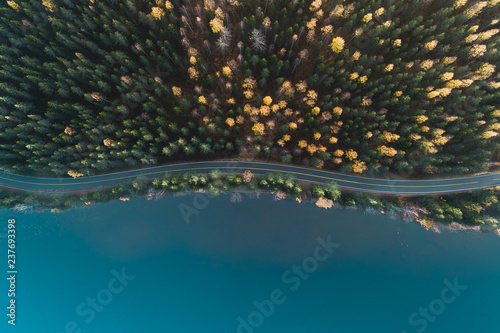 Above view of a road by lake and autumn forest, Finland