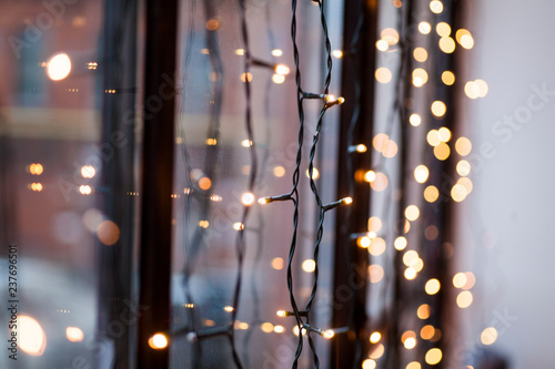 lights of garland on the background of the window