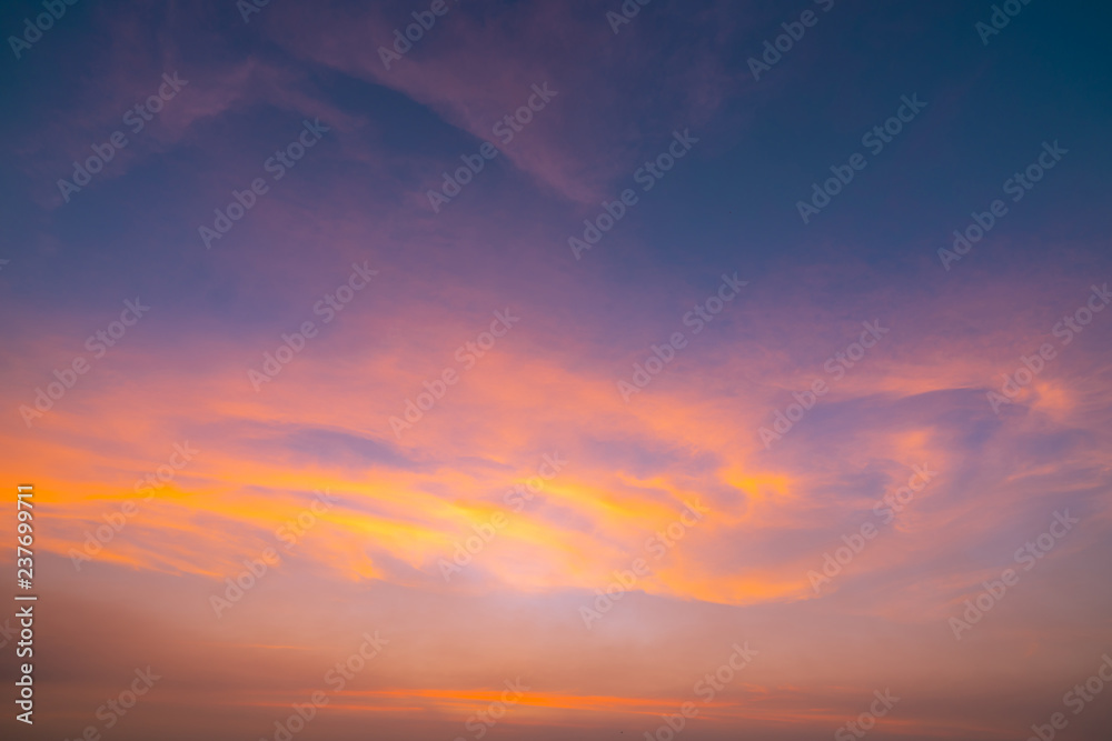 Dramatic orange sky and clouds abstract background. Art picture of orange clouds texture. Beautiful sunset sky. Sunset abstract background. Golden sky in the evening. Calm and relax life.