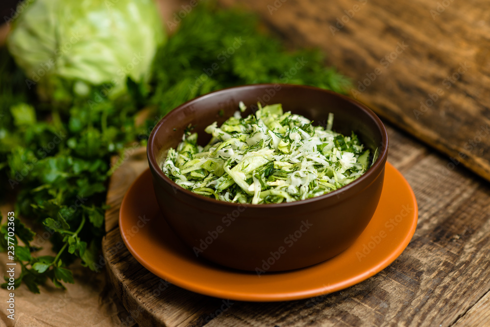 fresh cabbage salad in a clay plate fresh cabbage salad in a clay plate