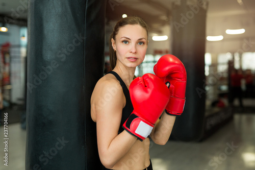 beautiful young girl training in a boxing gym © Alexandr