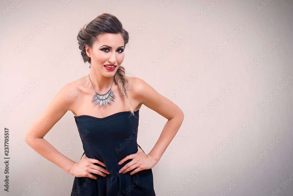 Fototapeta premium Attractive blonde woman smiling, with hands on the waist