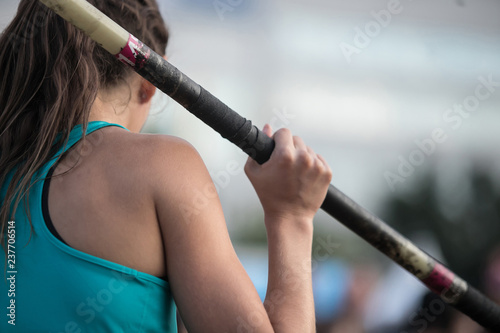 athlete in pole vault to prepare for jump on competition