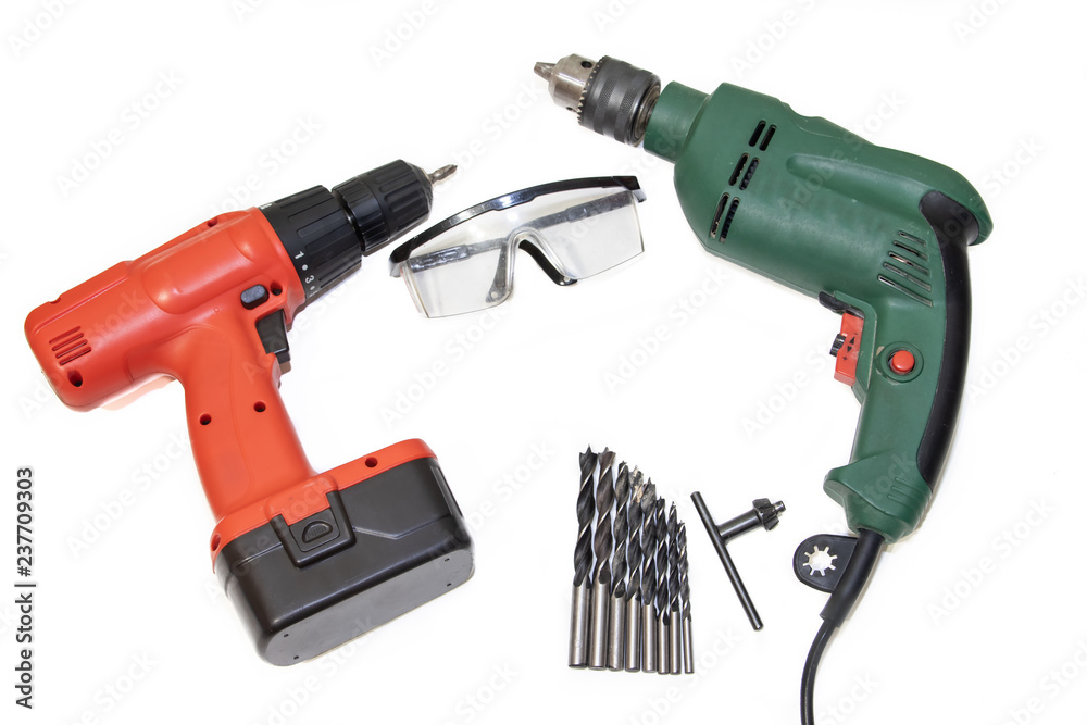 Drill and screwdriver on a white background Tools on a white background.. Items for repair and collection of furniture. Drill and screwdriver on a white background Tools on a white background.. Items for repair and collection of furniture.