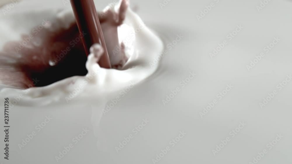 Super slow motion of pouring chocolate into milk, filmed with macro lens. Filmed on very high speed camera, 1000 fps.