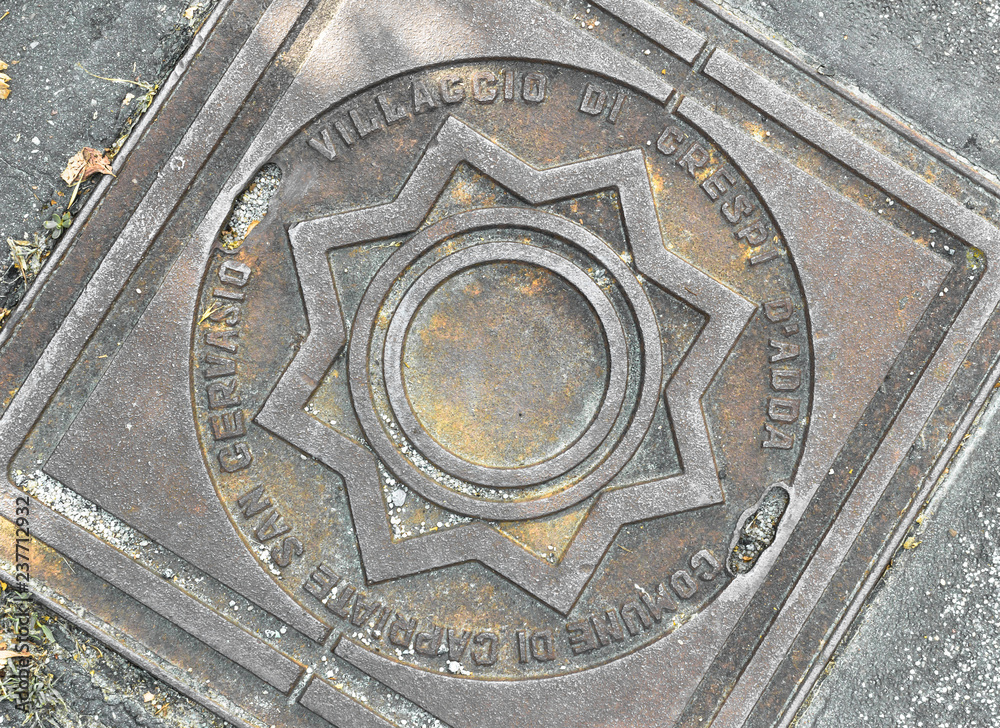 Manhole cover with the Crespi family logo