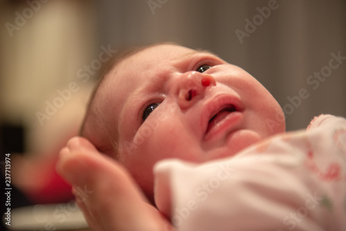 Tableau sur toile Newborn baby being held in hand