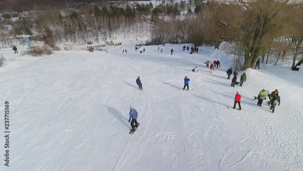 aerial of snowboarders sliding down the snowy slope. extreme sports, winter activities, healthy lifestyle