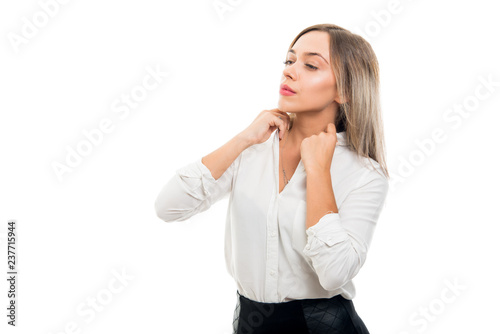 Portrait of beautiful business woman arranging shirt