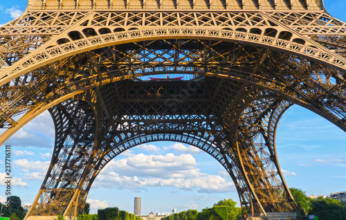 Paris / France - July 2015: The Eiffel Tower seen from below with the Tour Montparnasse in the distance. © Manel Vinuesa