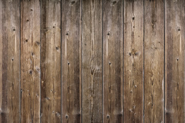 Brown wood texture. Abstract background, empty template. rustic weathered barn wood background with knots and nail holes. Close up of wall made of wooden planks.