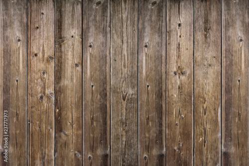 Brown wood texture. Abstract background, empty template. rustic weathered barn wood background with knots and nail holes. Close up of wall made of wooden planks.