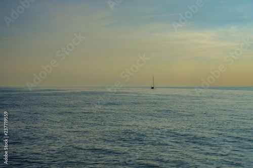 Sailing boat on the horizon © UllrichG